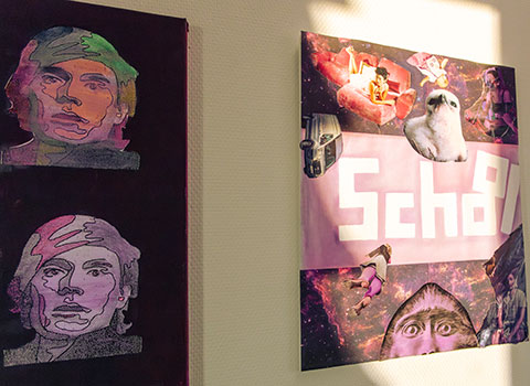 Das Bild zeigt zwei Grafiken die von Schlern erstellt wurden und nun in einem Schulflur hngen